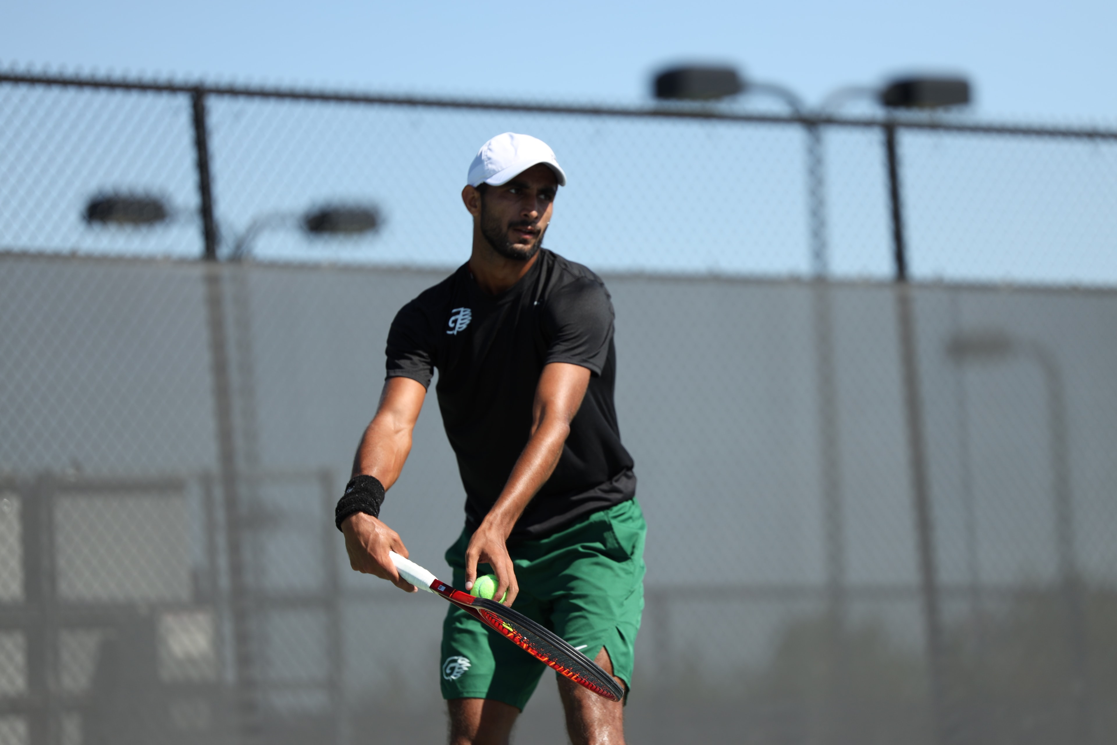 Paras on court during a tennis coaching session