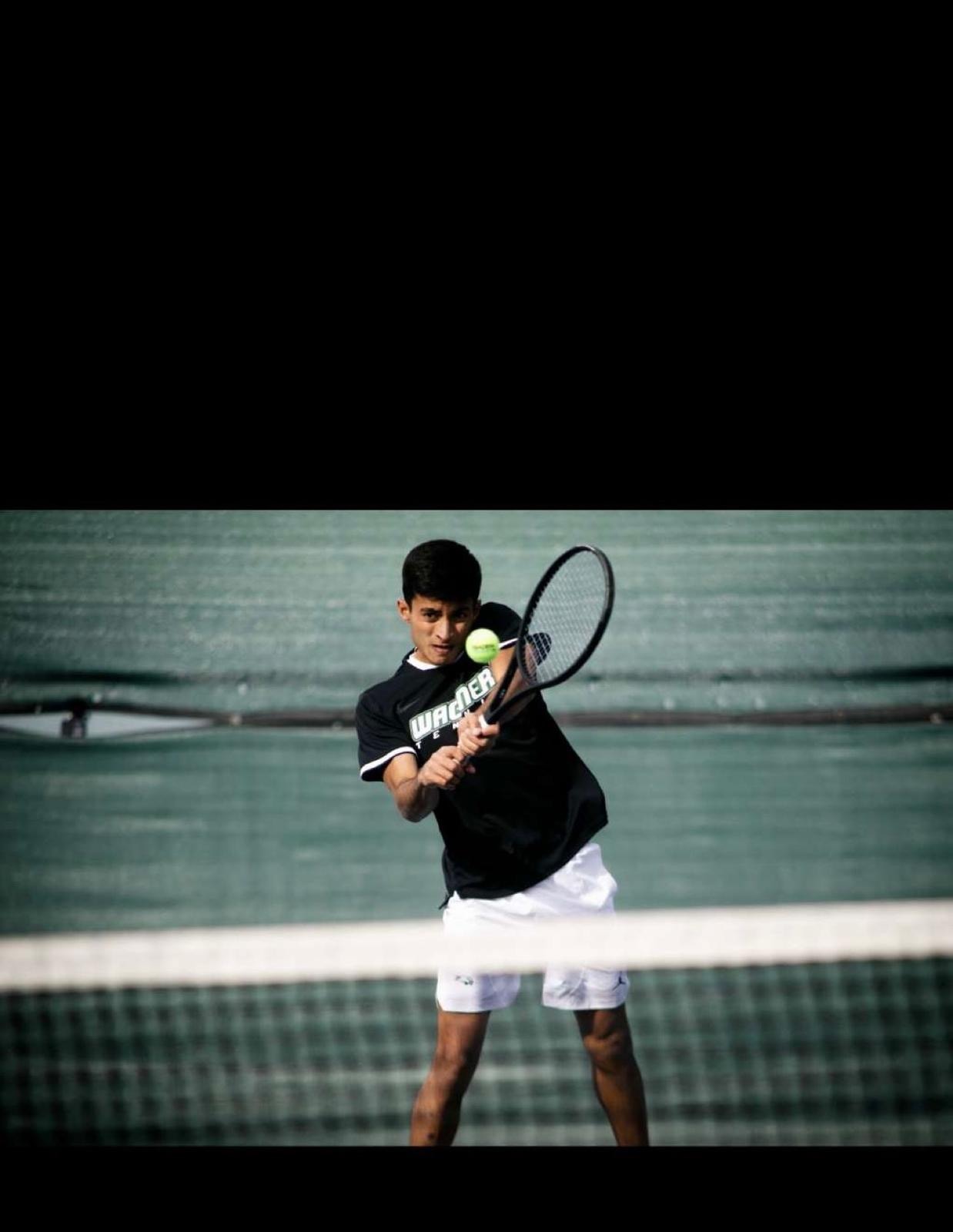 TJ coaching on the tennis court
